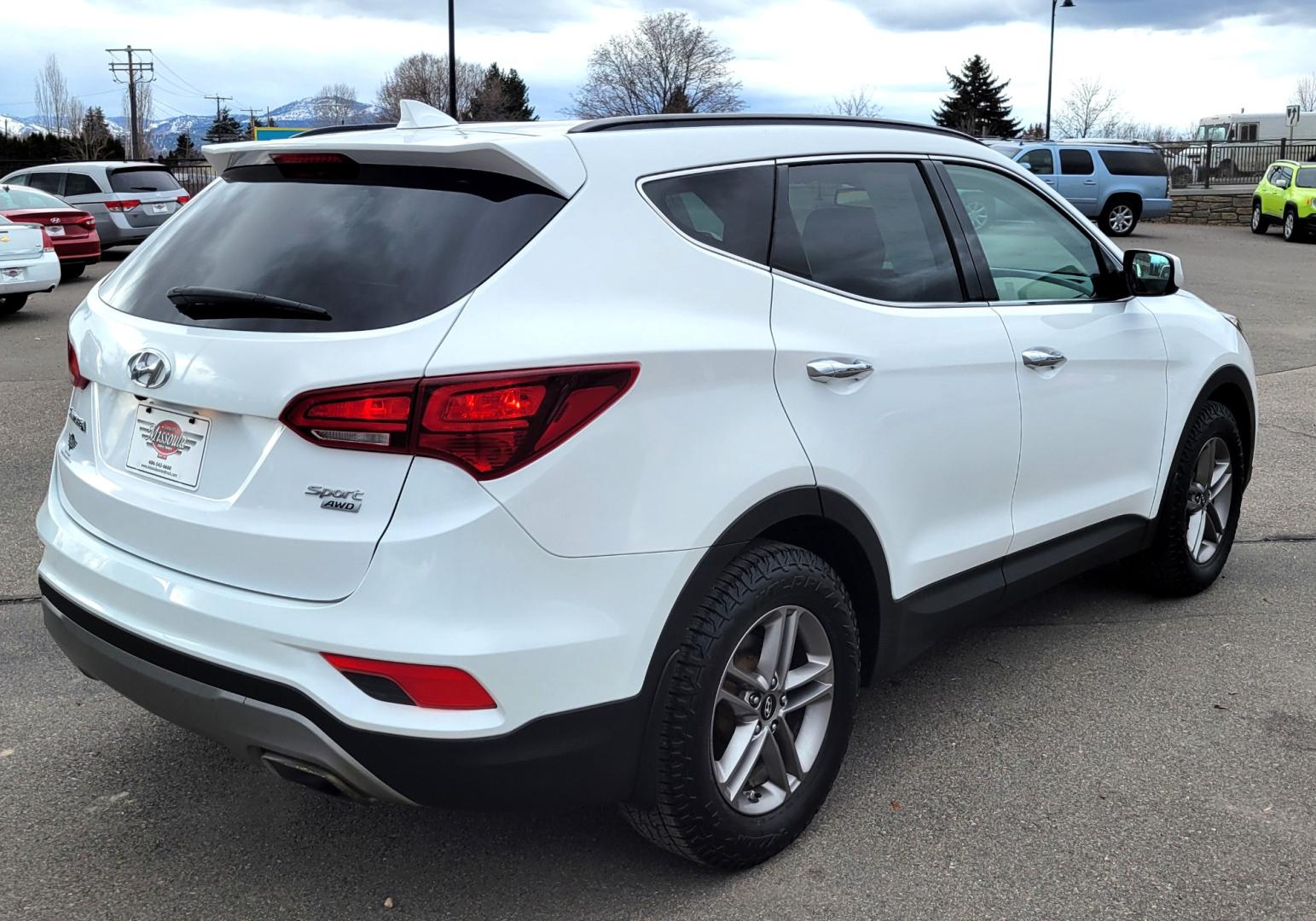 2017 White /Tan Hyundai Santa Fe Sport (5NMZUDLB9HH) with an 2.4L I4 engine, 6 Speed Auto transmission, located at 450 N Russell, Missoula, MT, 59801, (406) 543-6600, 46.874496, -114.017433 - Really Nice AWD SUV. 2.4L I4. 6 Speed Automatic Transmission. Remote Start. Backup Camera. Bluetooth. AM FM XM CD. Air. Cruise. Tilt. Power Windows and Locks. One Owner. Clean Carfax. - Photo#3